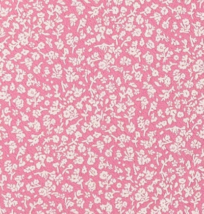 Pink and white floral print fabric swatch.