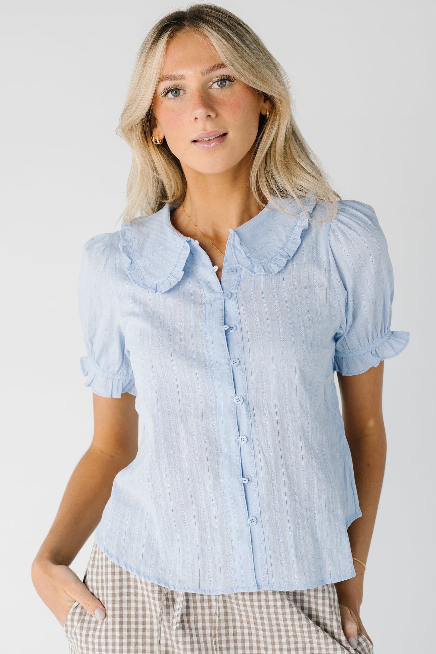 Baby blue button down top with rounded collar