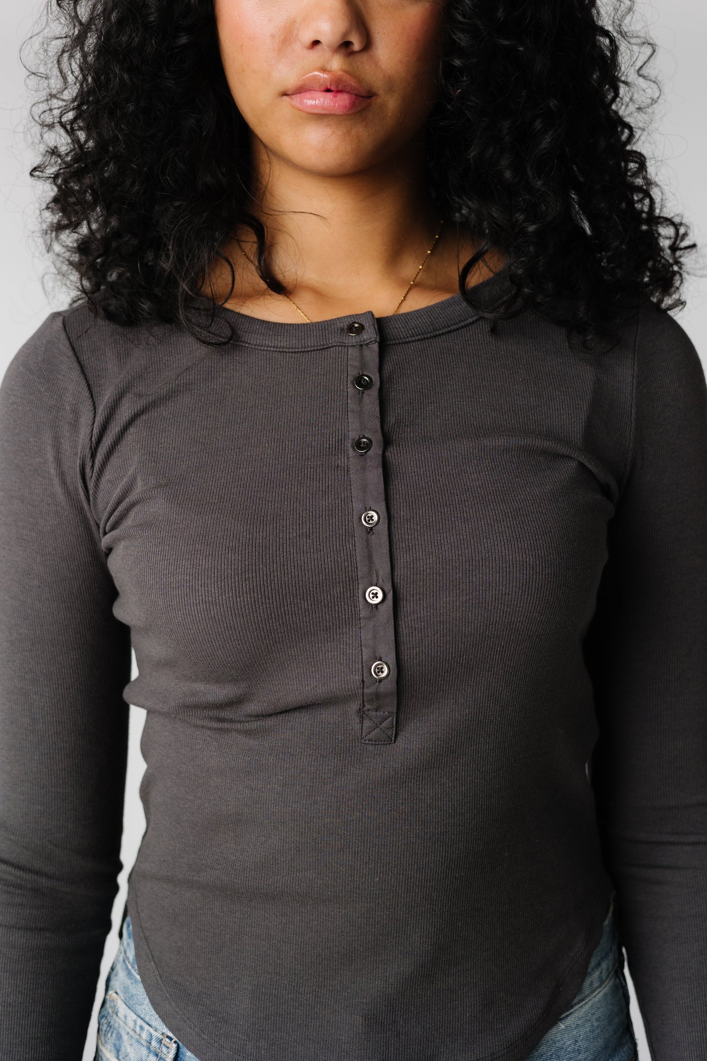 Close view of charcoal Henley style top