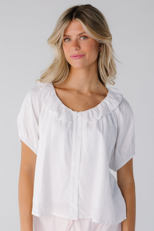 Modest white scoop neck top with ruffle collar