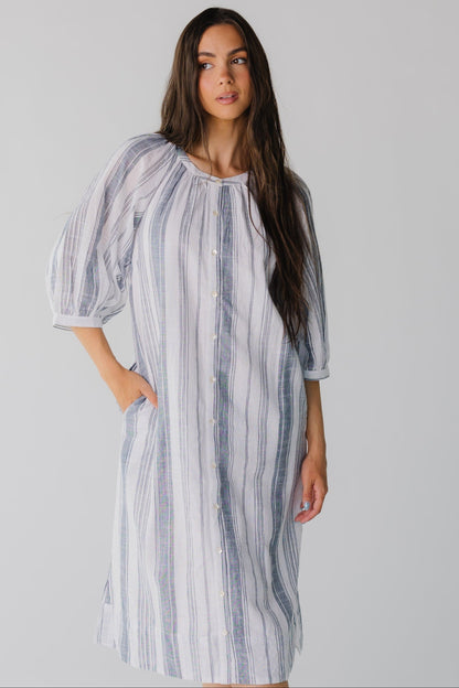 Modest blue and white stripe button down midi dress with three quarter length sleeves and round neck line.