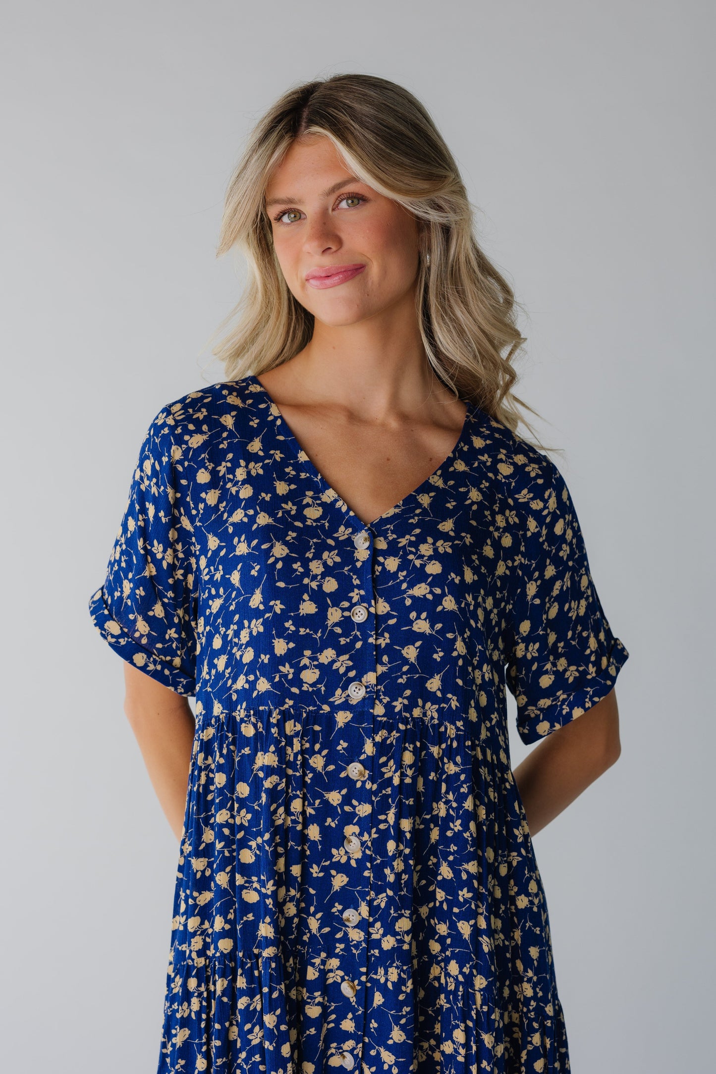 Close view of blue floral dress with short sleeves