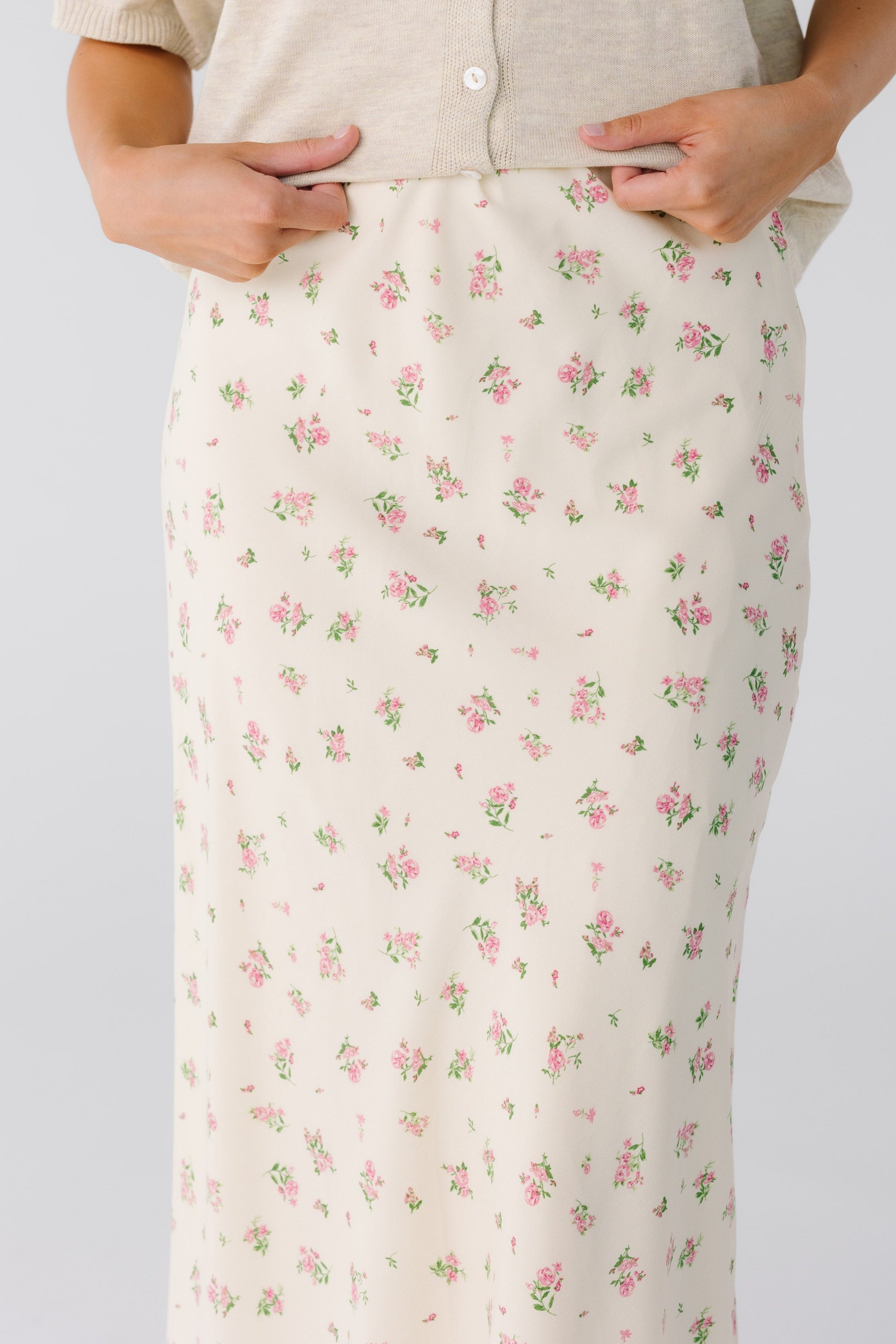 Close view of ivory floral print midi skirt