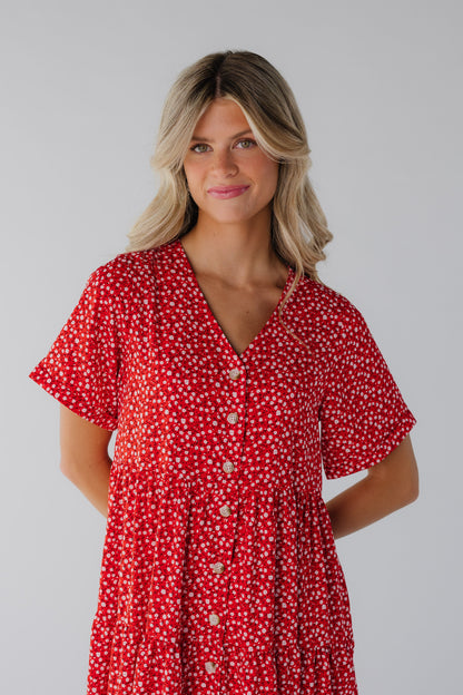 Close view of red floral dress with short sleeves and V-neckline
