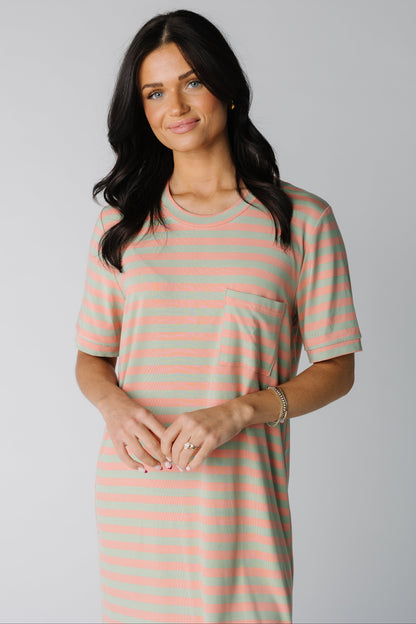 Close view of peach and sage short sleeve dress with front pocket
