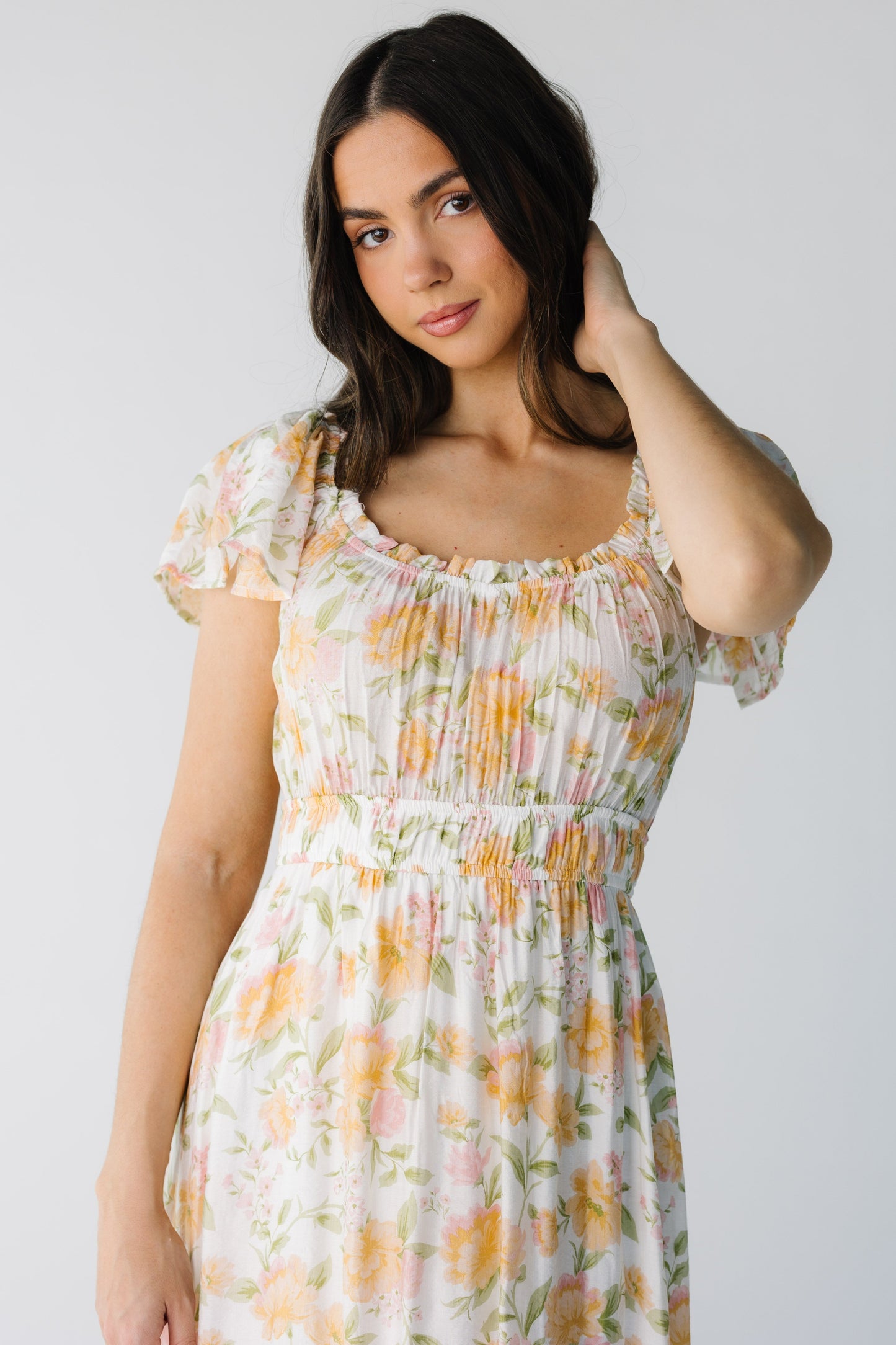 Close view of  yellow floral print midi with square neckline and wide elstic waist
