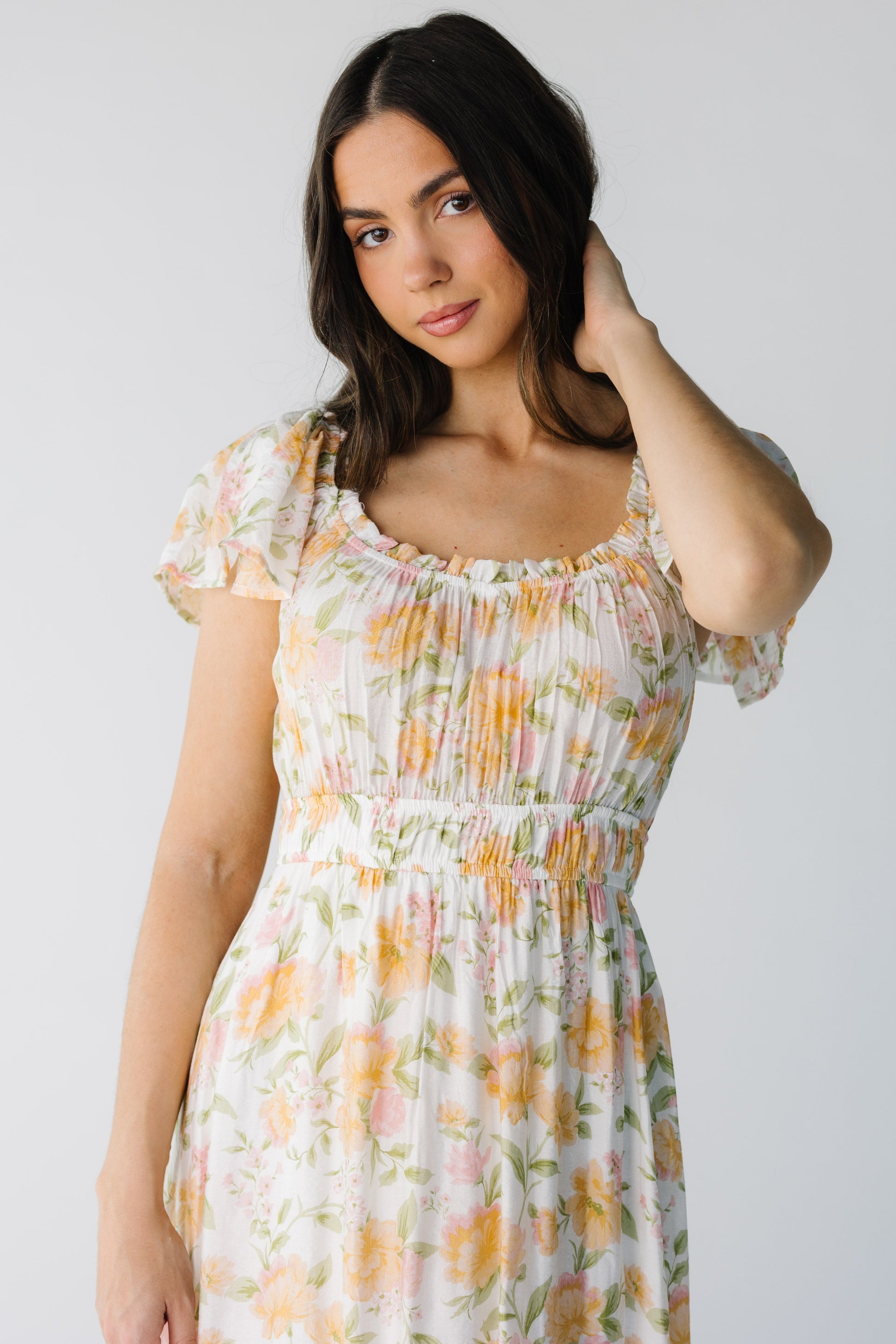 Close view of  yellow floral print midi with square neckline and wide elstic waist