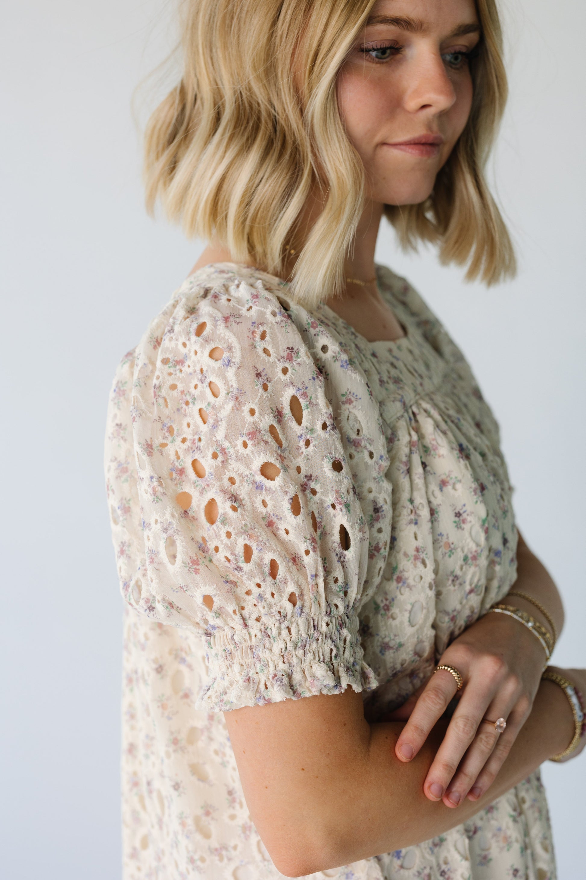 Close up view of floral eyelet dress