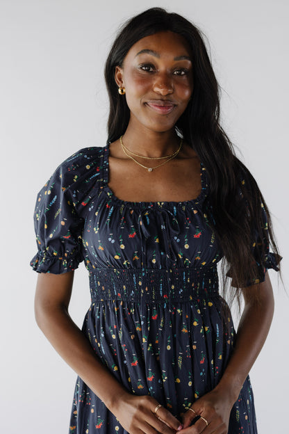 Close view of navy floral dress with square neckline and wide elastic waistband