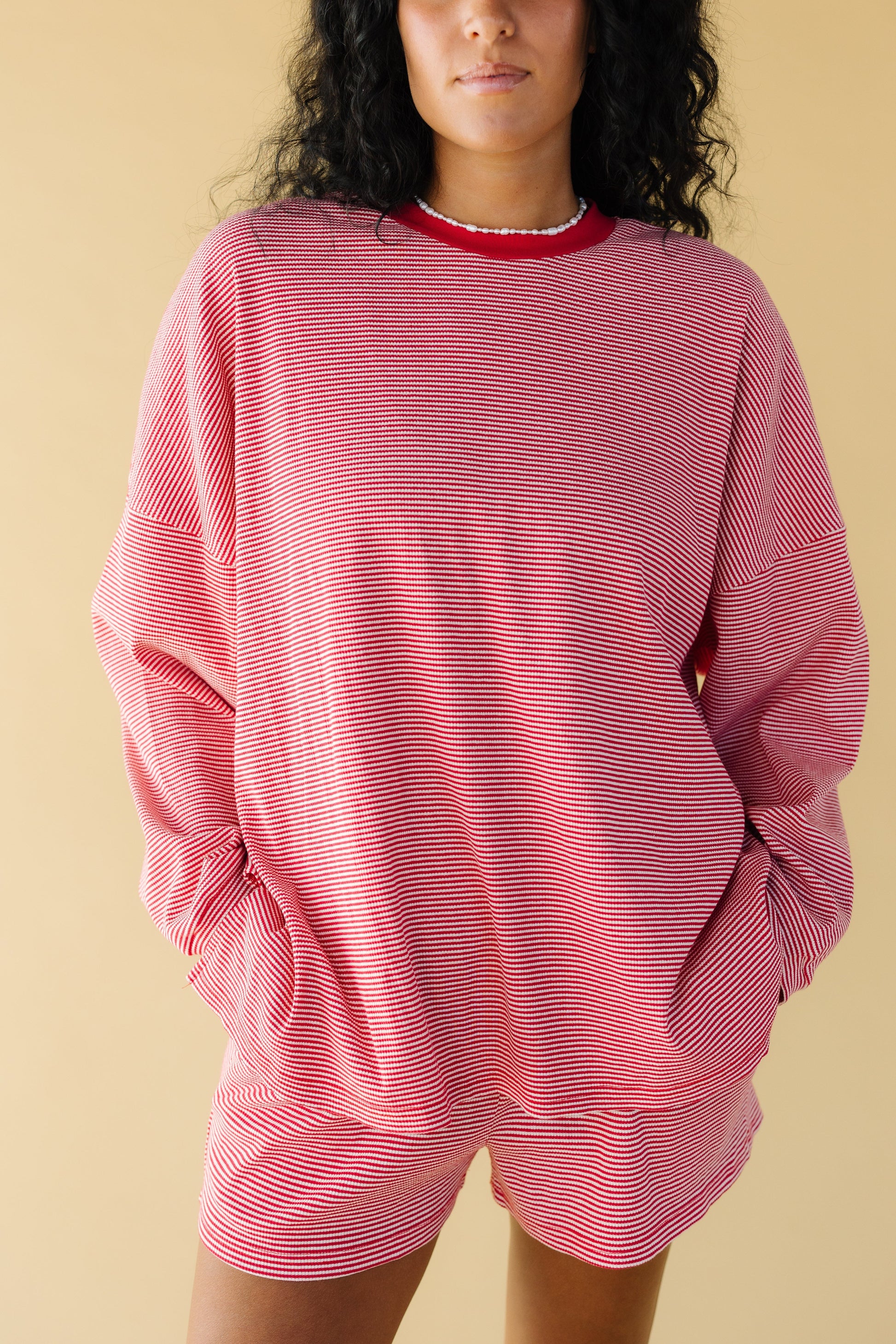 Woman wearing Poppy red & white stripe loose fitting top with Poppy stripe shorts.