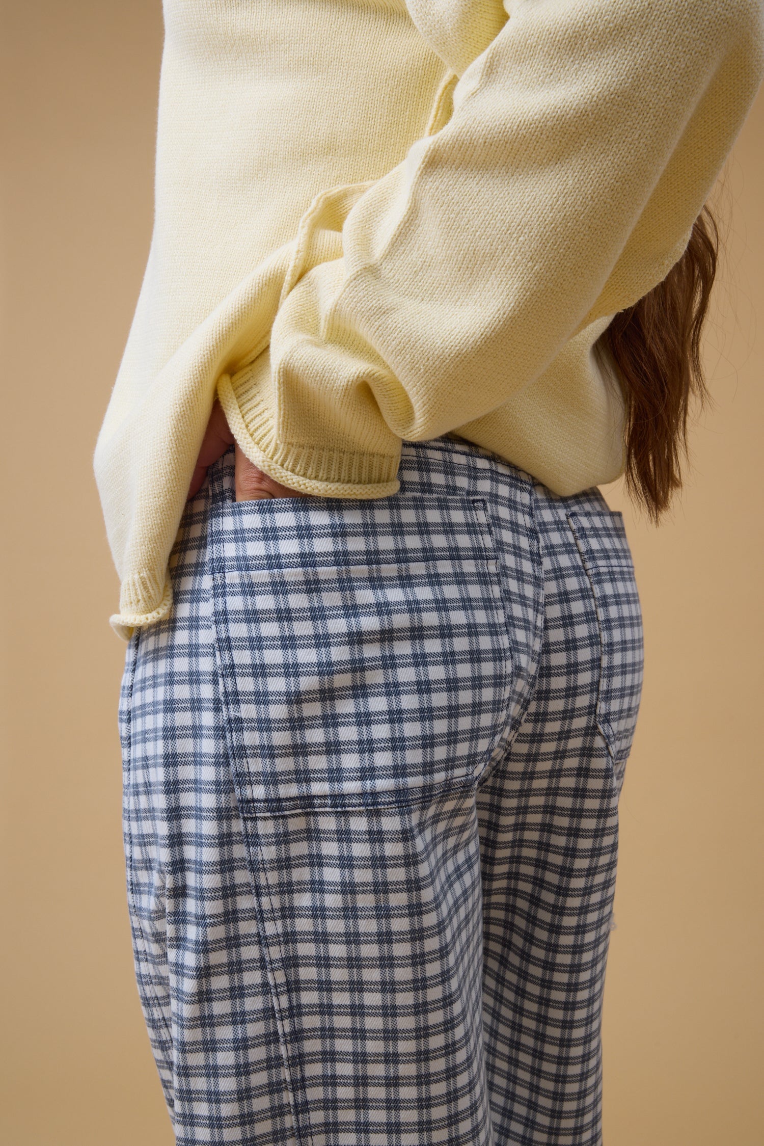 Close view of a woman wearing navy  & white plaid check for women and teen girls.