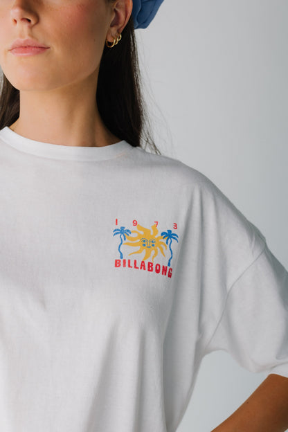 Close view of white graphic tee with small front graphic