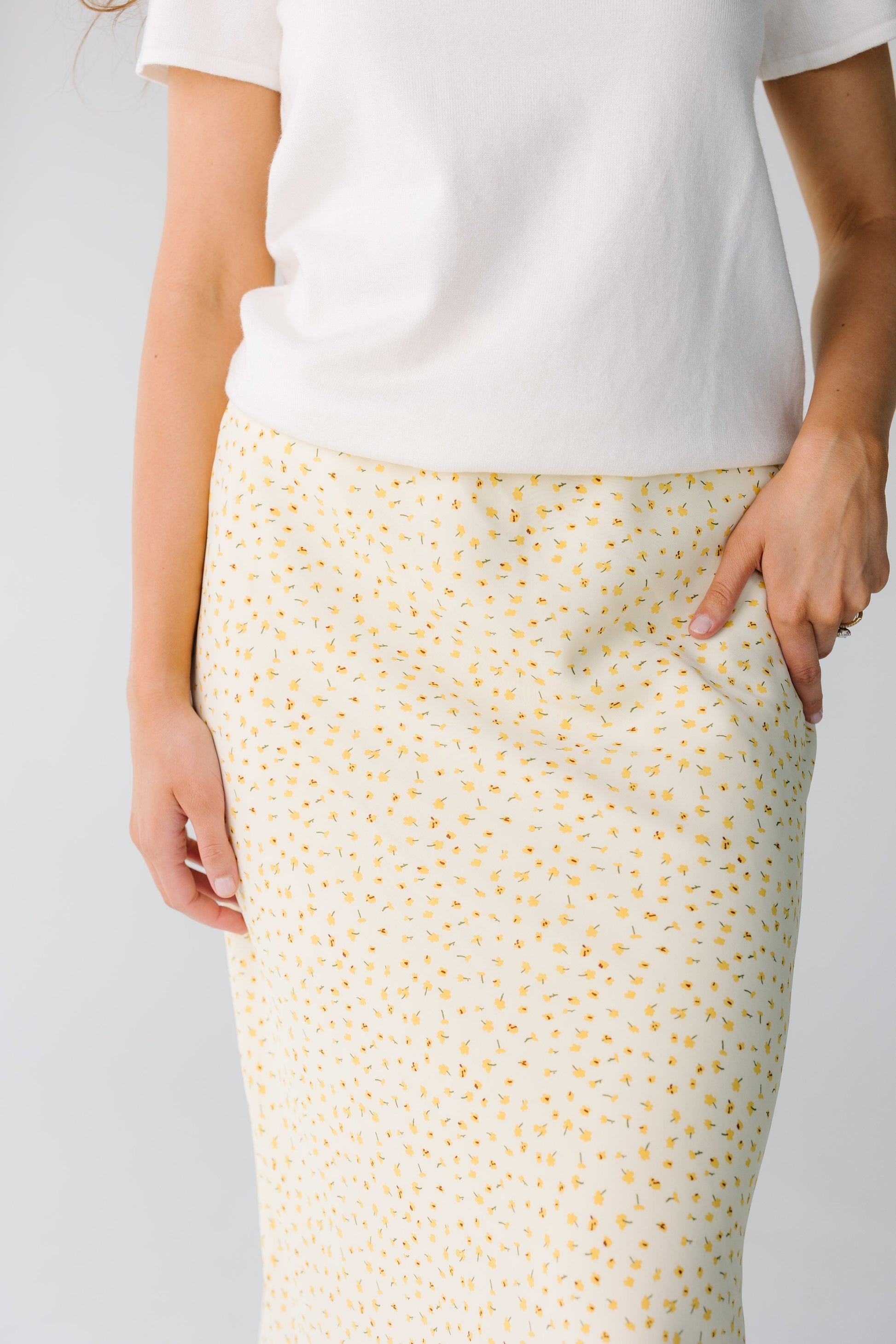 Close view of yellow floral midi skirt