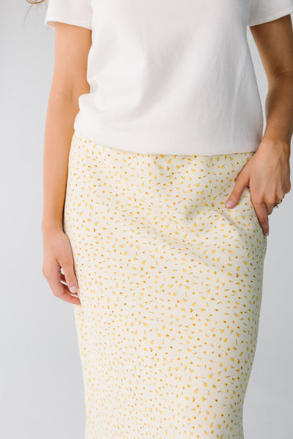 Close view of yellow floral midi skirt