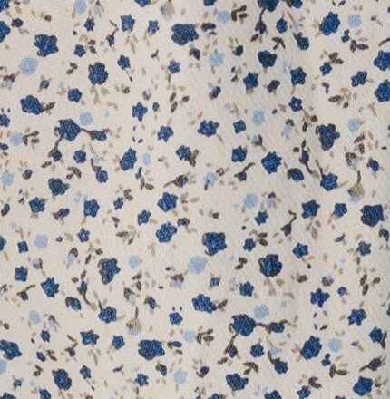 Cream & blue floral fabric swatch.