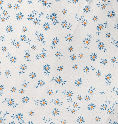 White with blue floral print fabric swatch.