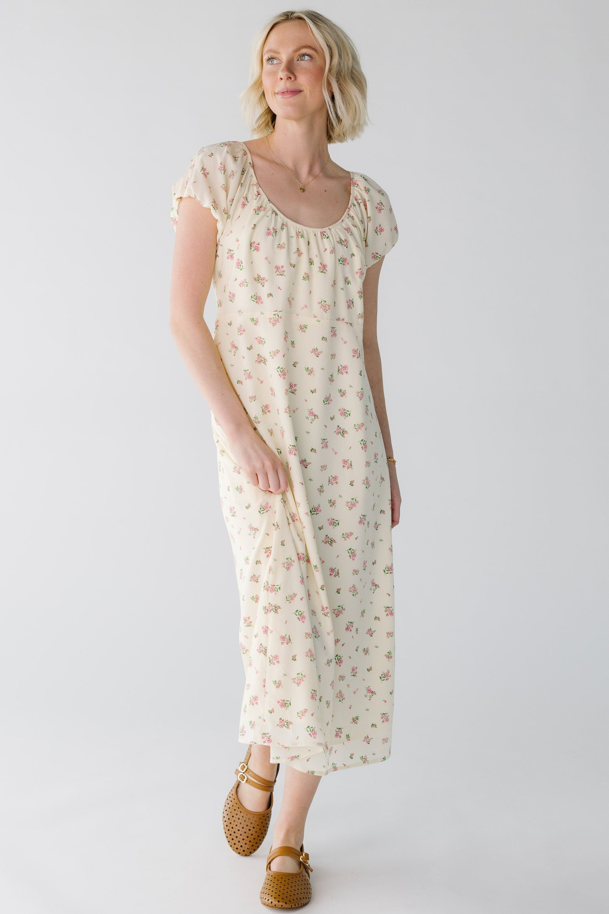 Modest cream floral midi with scoop neckline and short puff sleeves