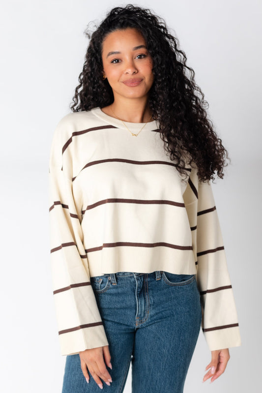 Cream sweater with narrow brown stripes