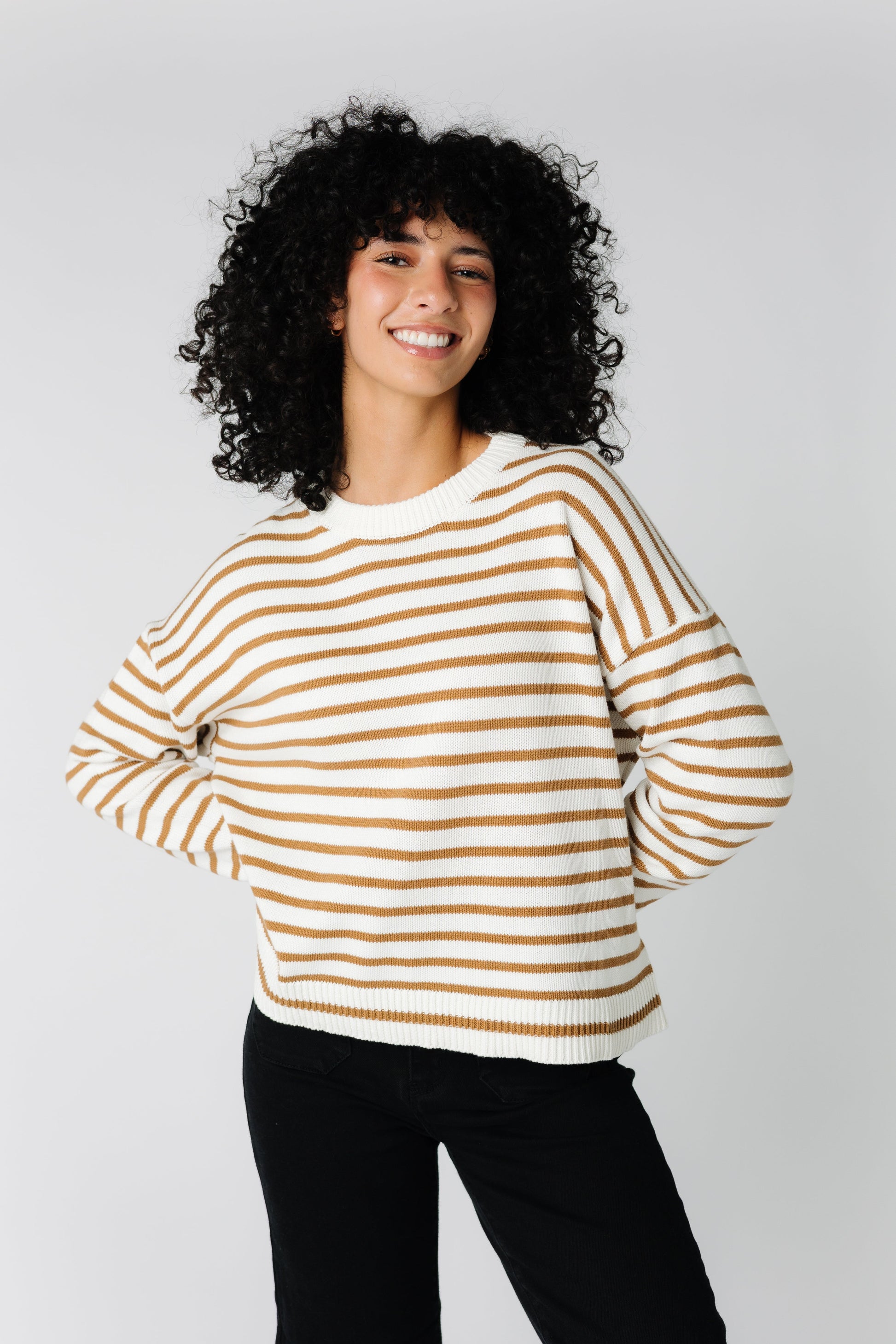 Cream striped sweater with crew neckline and long sleeves