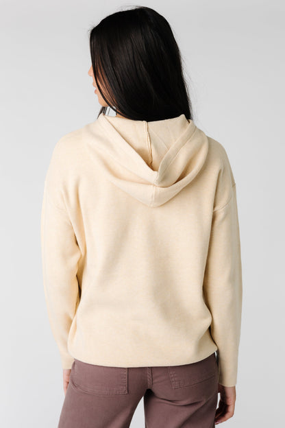 Back view of cream long sleeve hoodie