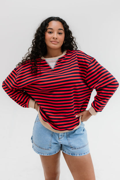 Red and navy long sleeve sweatshirt with crew neckline