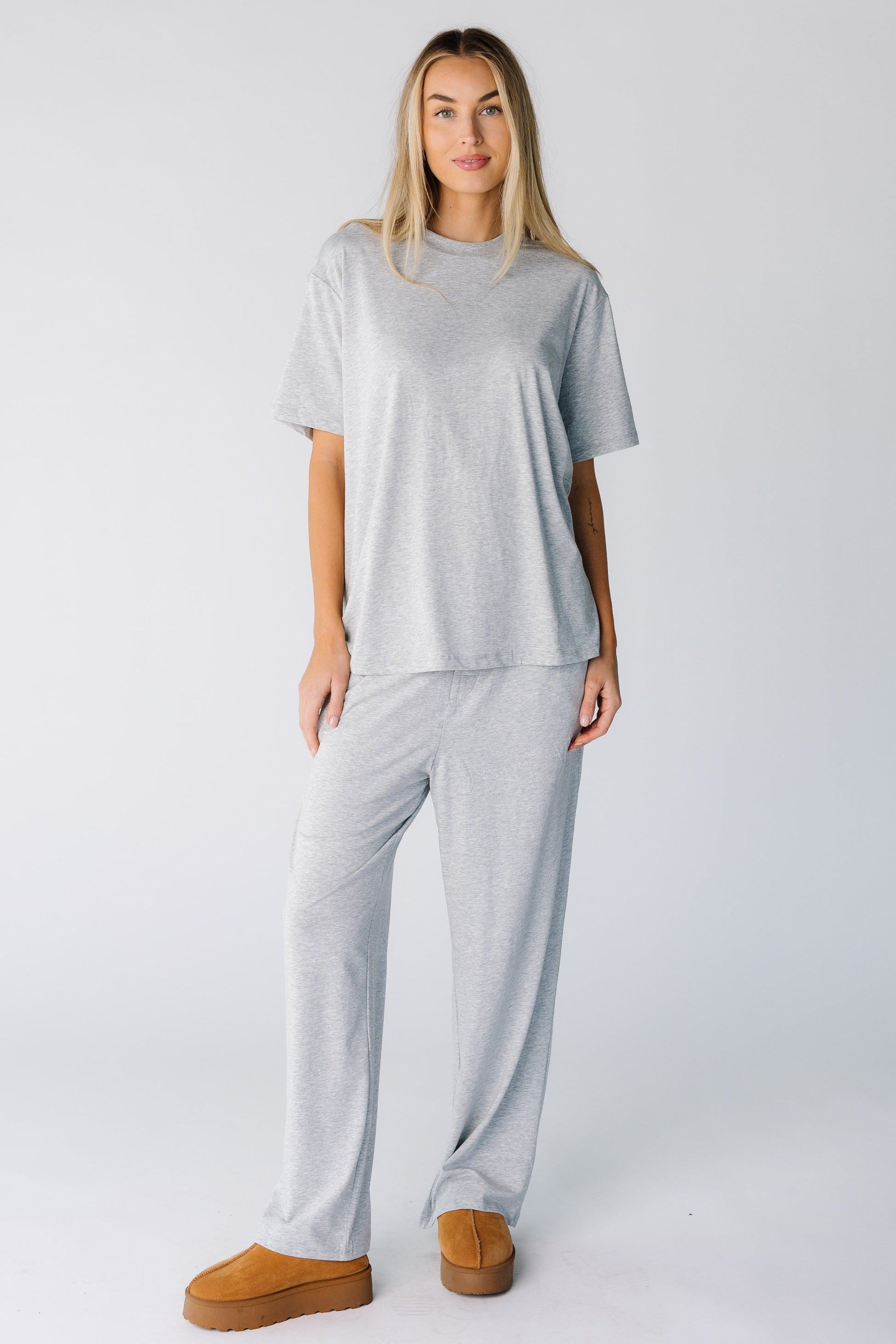 Woman wearing a modest lounge set with a round neckline and short sleeves with full length bottoms