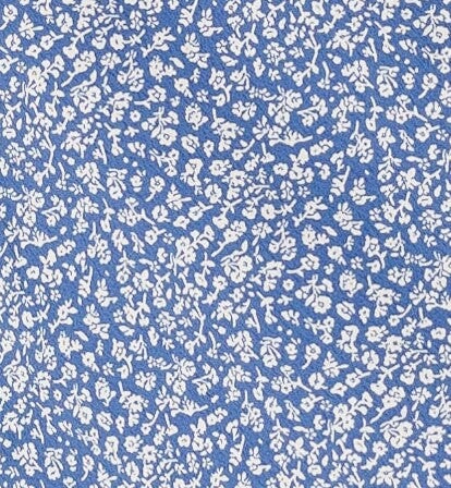 Dusty blue and white floral print fabric swatch.