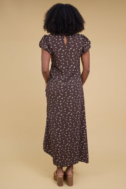Back view of a woman wearing brown floral maxi dress with gathered cap sleeves.