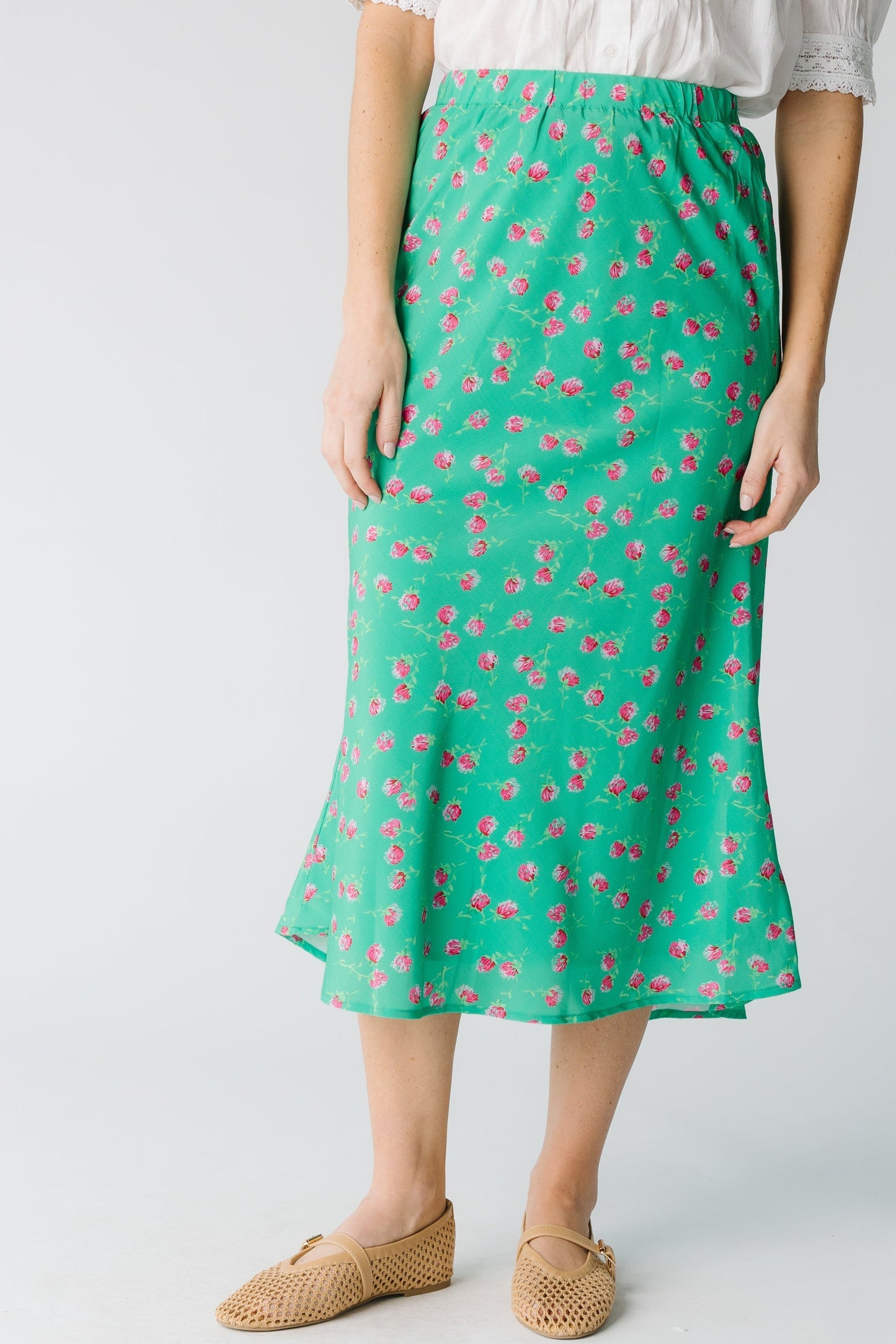 Modest A-line midi skirt in green with pink floral print