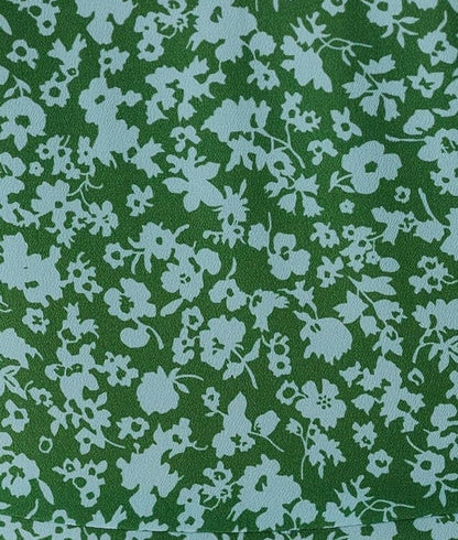 green and light blue floral print fabric swatch.
