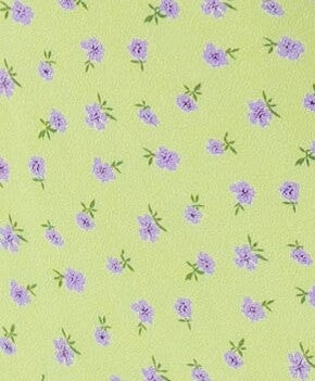 Green and lavender floral print fabric swatch.