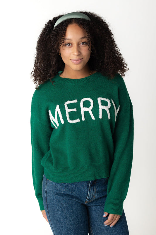 Green holiday sweater with white MERRY graphic