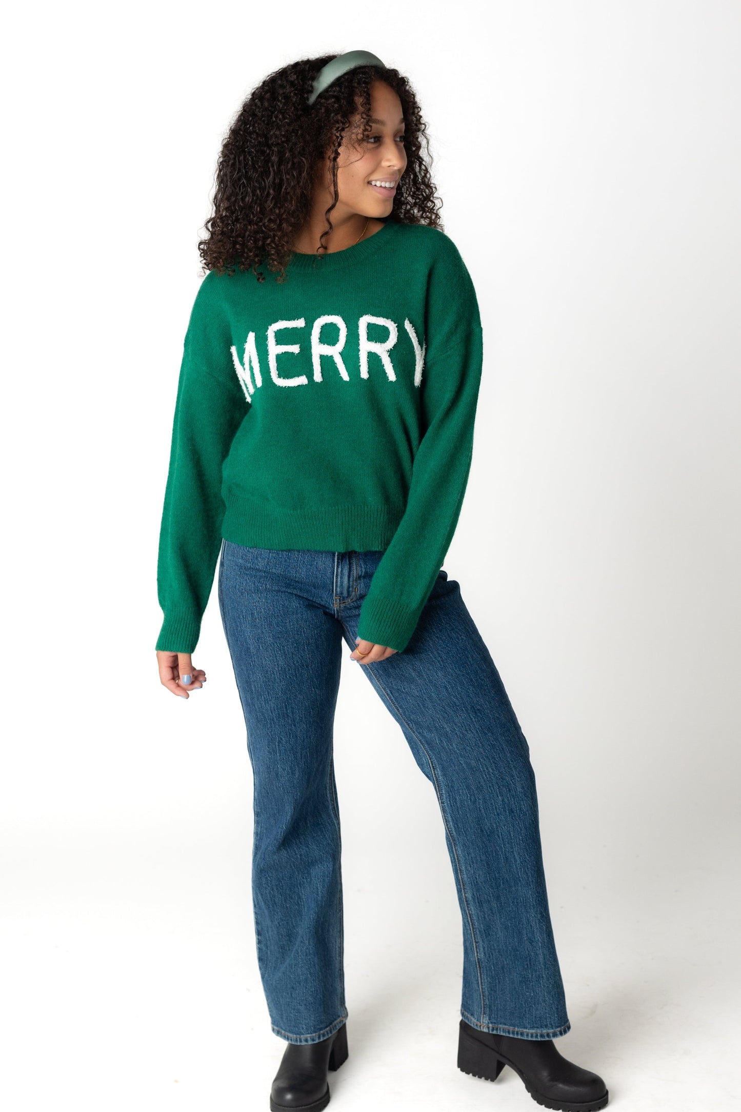 Modest long sleeve green crewneck sweater with white MERRY front graphic