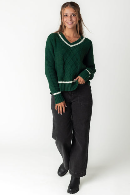 Green cabled sweater with long sleeve and V-neckline