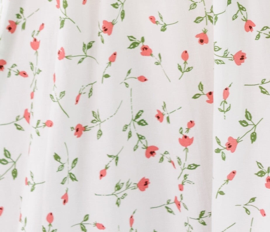 Ivory with red floral print fabric swatch.