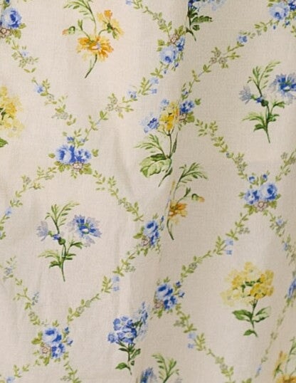 Cream with multi-color floral print fabric swatch.