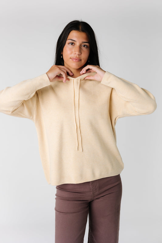 Cream pullover drawstring hoodie with long sleeves