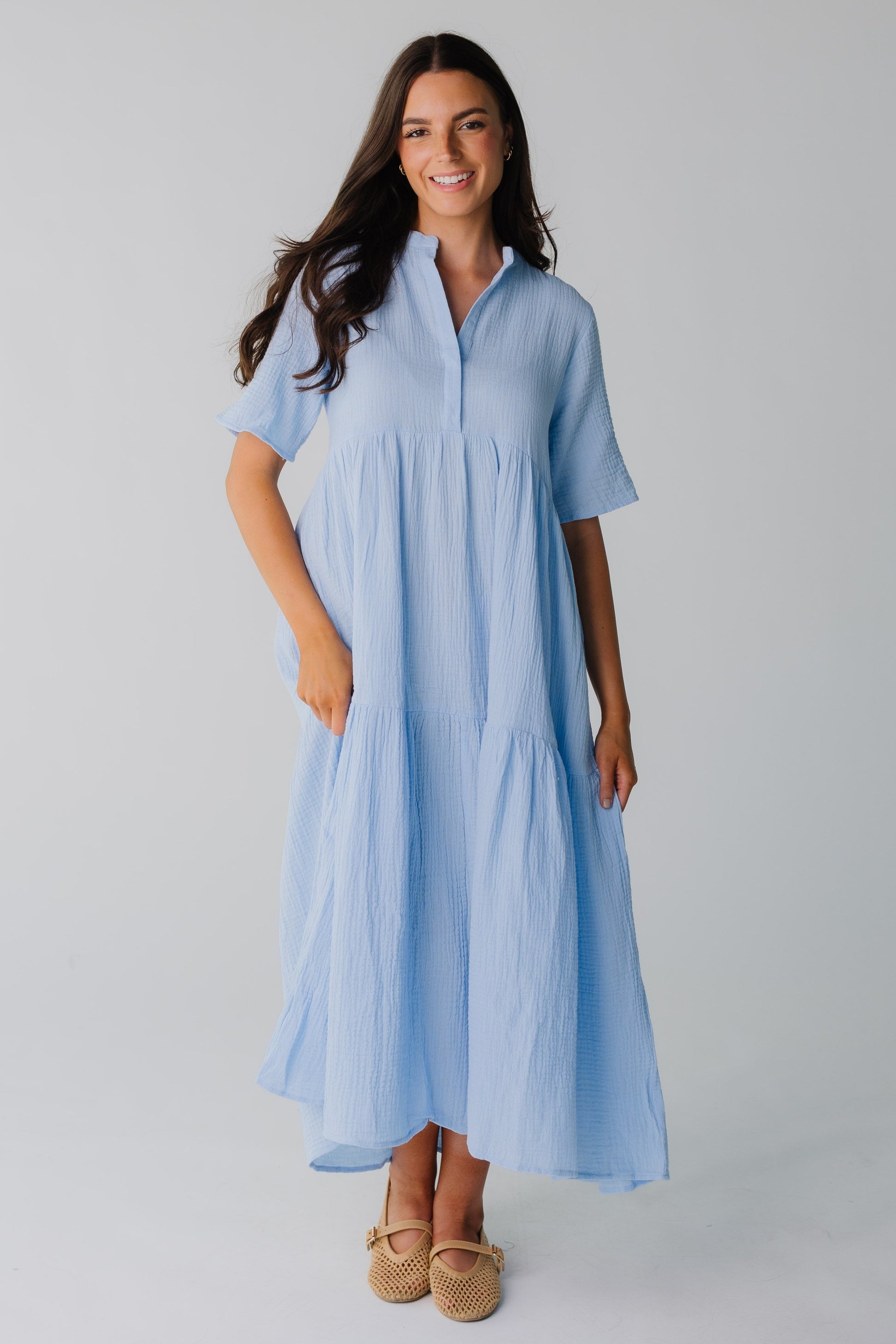 Light blue women's midi dress with wide bottom ruffle and short sleeves