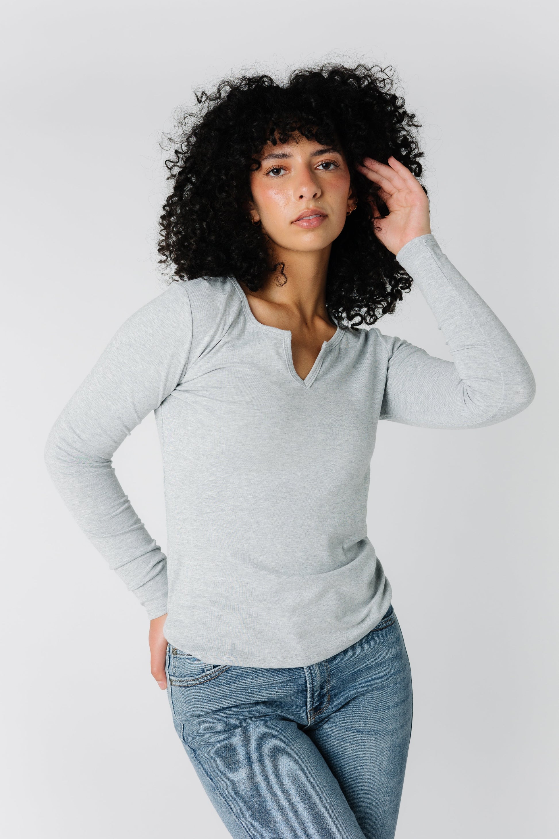 Modest light grey rib knit top with long sleeves and notched front neckline