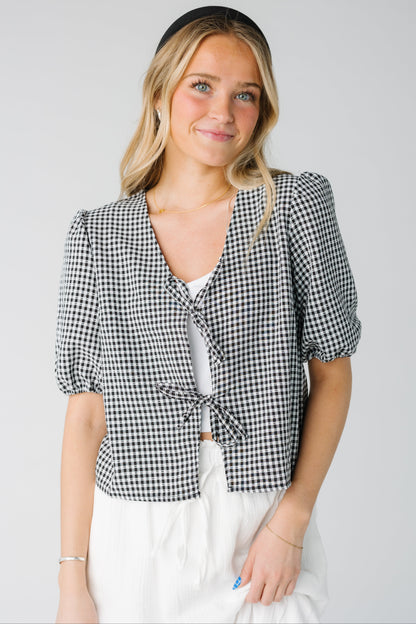V-neck gingham top in black and white with short puff sleeves