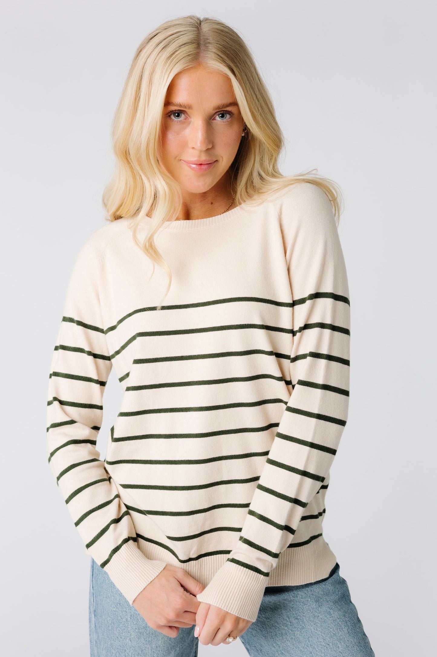 Modest cream sweater with long sleeves and forest green stripes