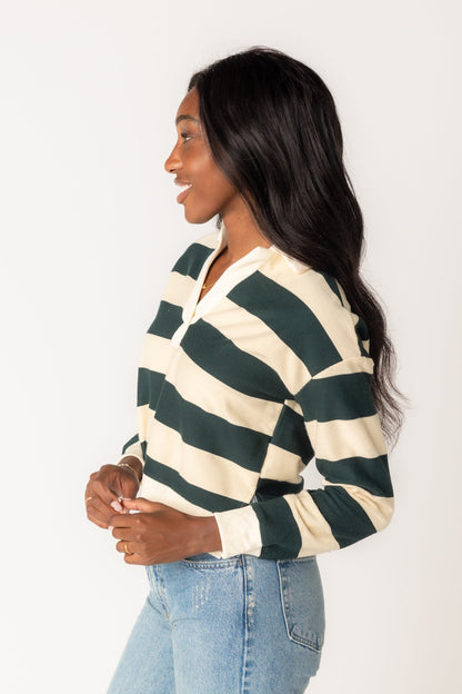 Side view of Green wide stripe shirt with long cuffed sleeves and V-neckline and pointed collar