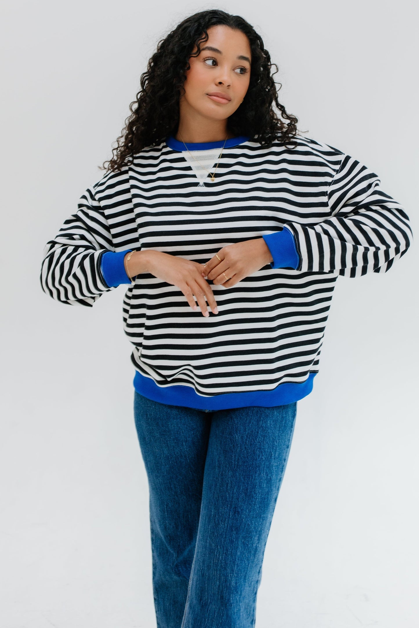 Modest black and white stripe sweatshirt with crew neckline and long sleeves