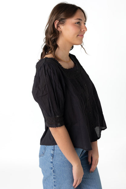 Side view of black square neck op with short sleeves