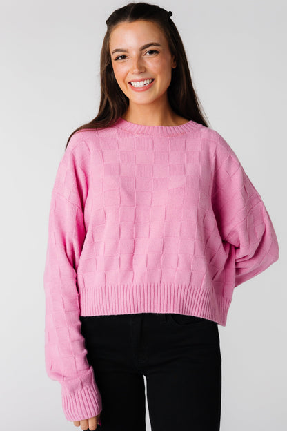 Pink oversized textured sweater with long sleeves