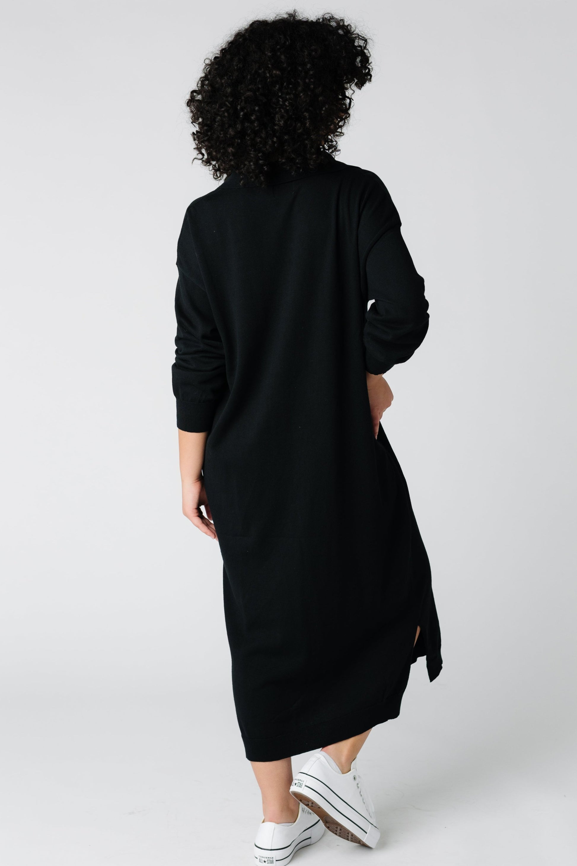 Back view of black sweater dress