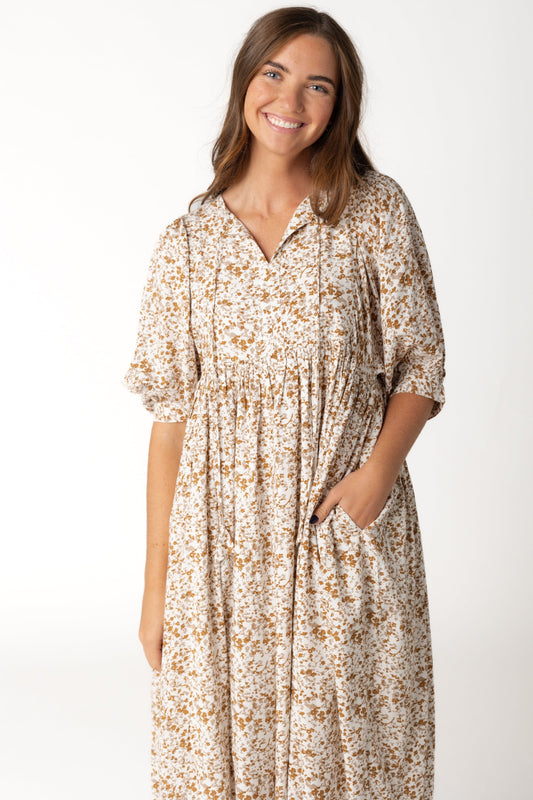 Ivory and brown print midi dress with V-neckline with ties and half length sleeves