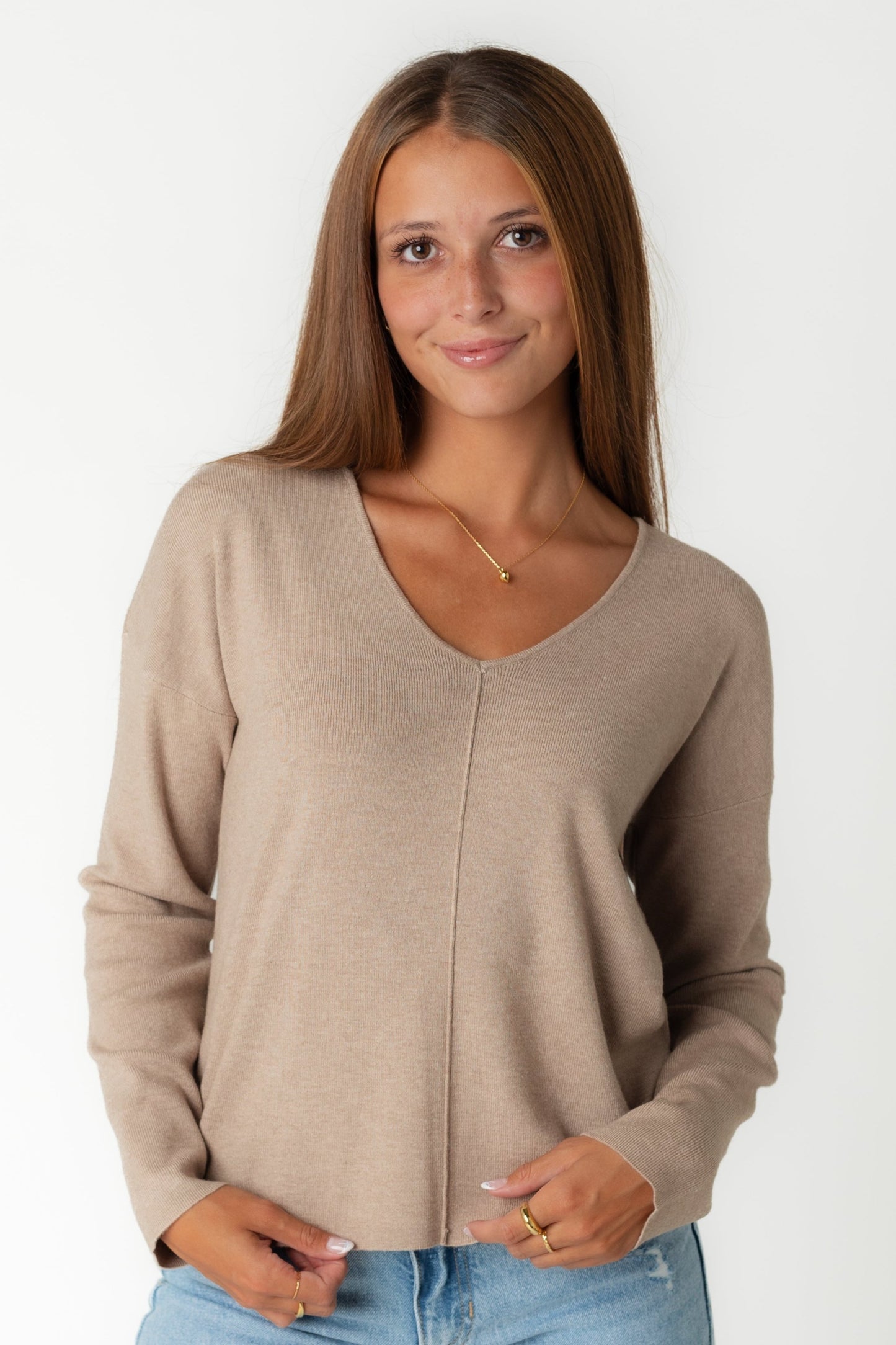 V-neck mocha sweater with drop shoulders and long sleeves