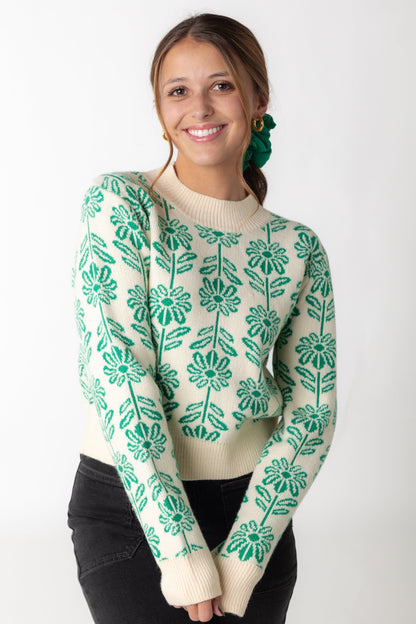 Green floral sweater with crew neckline and long sleeves