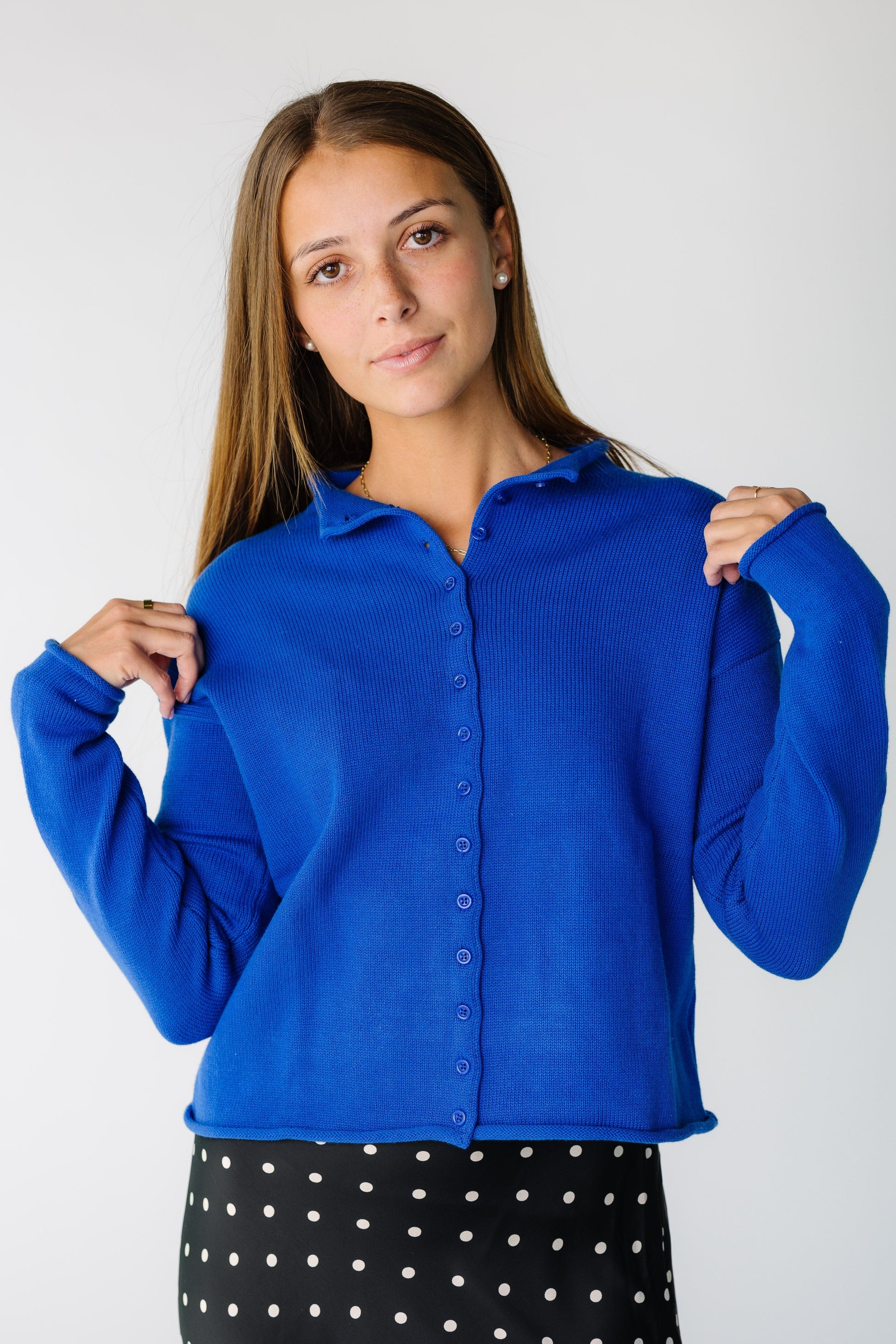 Woman wearing a long sleeve button cardigan 